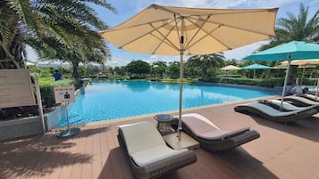 4 outdoor pools, open 6:00 AM to 8:00 PM, pool umbrellas, pool loungers