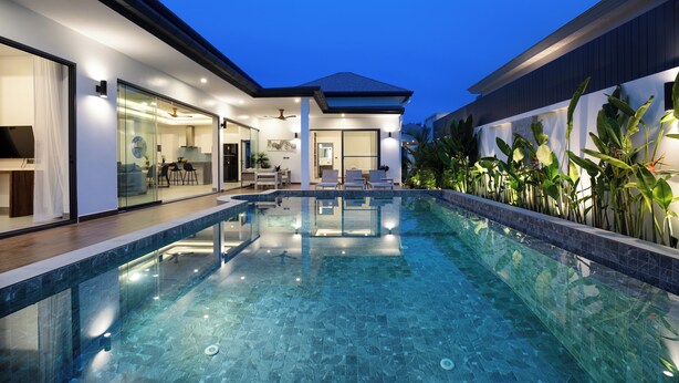 A modern house with a swimming pool, glass doors, and a patio area. - Two-Bedroom Villa with Salt Pool in Rawai (rawai)