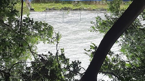 A river with a metal railing in the background. - The Grand Sun City Hotel & Resort (Bhopal)