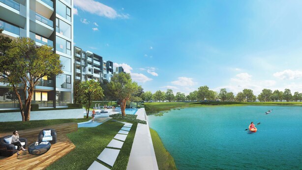 Un immeuble résidentiel moderne doté d’une piscine, d’un espace extérieur aménagé et offrant une vue sur un lac.
