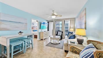 Signature Condo, 2 Bedrooms, Non Smoking, Balcony | Living room | 65-inch Smart TV with cable channels
