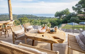 Relax in a serene outdoor seating area with a picturesque view of the landscape.