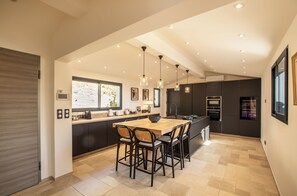Enjoy cooking in this kitchen with a central island, oven, and microwave.
