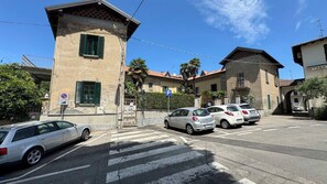 Stroll through the charming streets, lined with parked cars and pedestrian crossings.