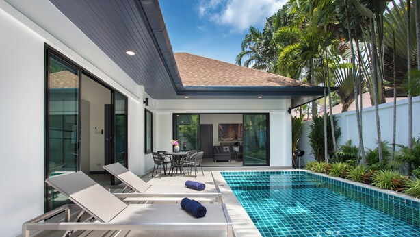 A modern house with a swimming pool, lounge chairs, and a dining area. - Villa Elima, lovely pool two bedrooms villa at rawai (rawai)