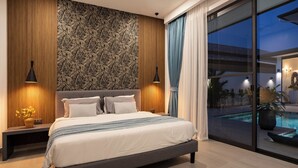 A modern bedroom with a large bed, a patterned wall, and a view of a swimming pool.