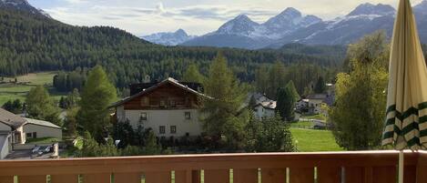 Enjoy breathtaking views of snow-capped mountains from this balcony.