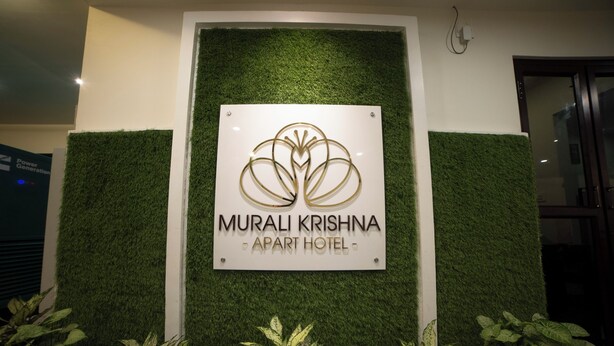 A sign for Murali Krishna Apartment Hotel with a logo and name. - MURALI KRISHNA APART HOTEL (Kakinada)