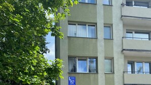 A multi-story building with a sign indicating apartment number 757. - Mini Studio 2 by Grand Apartments (Sopot)