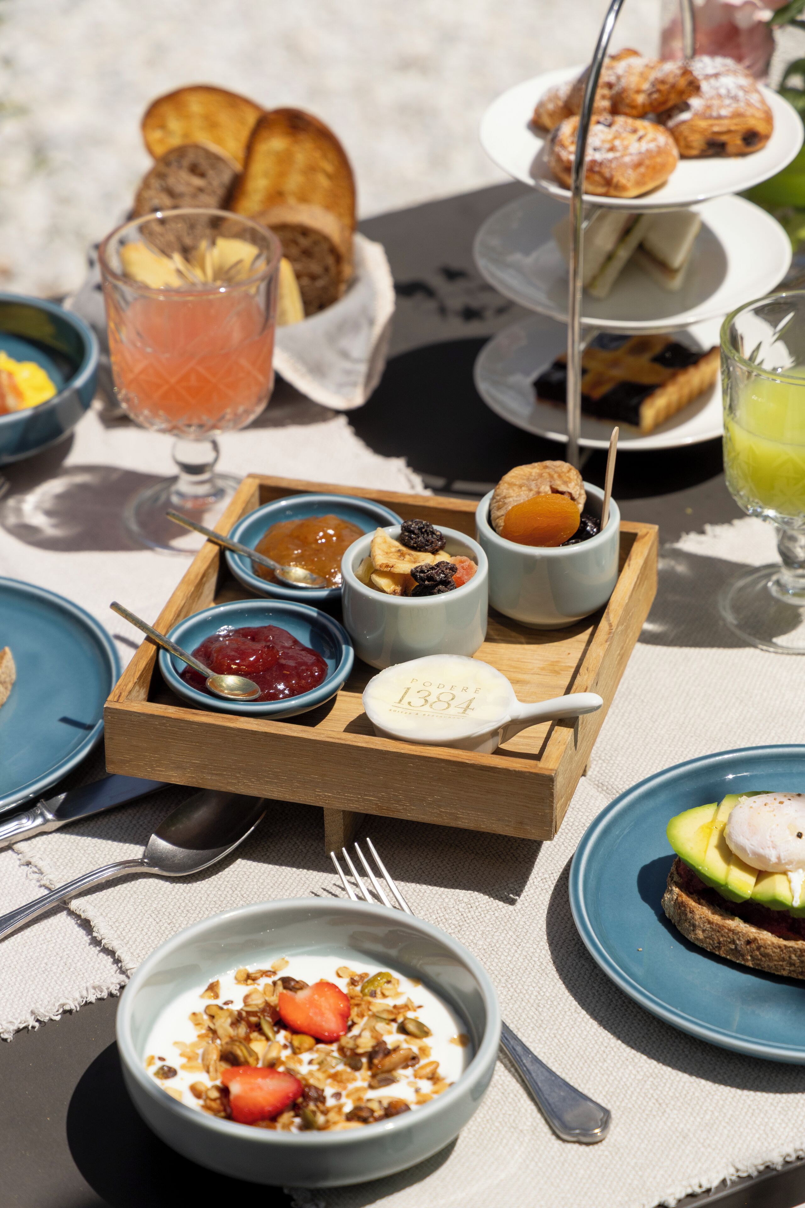 A breakfast buffet with various food items and a tray of condiments.