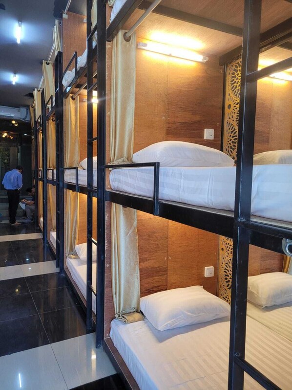 A bunk bed room with wooden walls and a decorative panel. - Hangover Hostel Patong (Patong)
