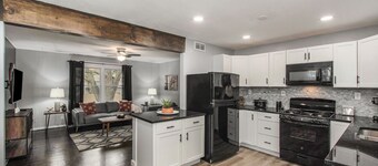 Remodeled 3BR w/ queen beds on 1/2 acre backing to open space. Bonus basement living room + extra bath. Chef’s kitchen, W/D, patio + outdoor dining. Bright, private setting w/ shade trees near Raymore/Belton. Fast WiFi.