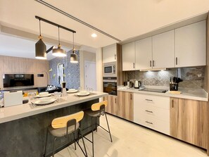 Full-sized fridge, microwave, oven, stovetop - C Living - Premium 3 Bedroom - AQIQ (Riyadh)