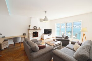 Family Apartment, 3 Bedrooms, Balcony, Sea View | Living area | 32-inch LED TV with cable channels, Netflix, streaming services