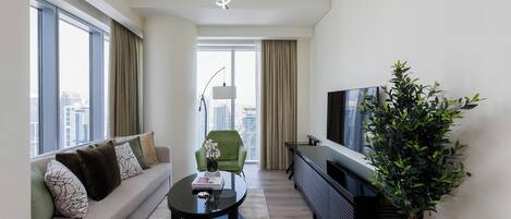 Apartamento Deluxe, 1 habitación, vistas a la ciudad | Zona de estar