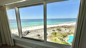 A room with large windows overlooking a beach. - Beach front Gulf Views Golf Cart 4112 BS1 (Miramar Beach)