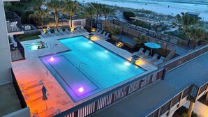 A swimming pool with lounge chairs and a deck area overlooking the beach. - Beach front Gulf Views Golf Cart 4112 BS1 (Miramar Beach)
