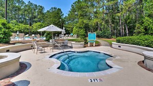A hot tub surrounded by lounge chairs and umbrellas, with a sign indicating a 3 ft depth. - 3 Mi to Cherry Grove Beach: Coastal Condo Retreat! (North Myrtle Beach)