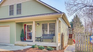 A two-story house with a porch, a garage, and a fenced yard. - 1 Mi to Dtwn Black Mountain: Home w/ Patio & Yard (Black Mountain)