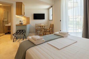 Superior Studio, Pool View | In-room safe, blackout drapes, soundproofing, iron/ironing board