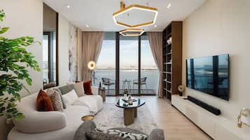 Departamento Deluxe, 2 habitaciones, balcón, vista al mar | Área de sala de estar