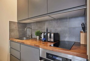 Fridge, microwave, stovetop, coffee/tea maker