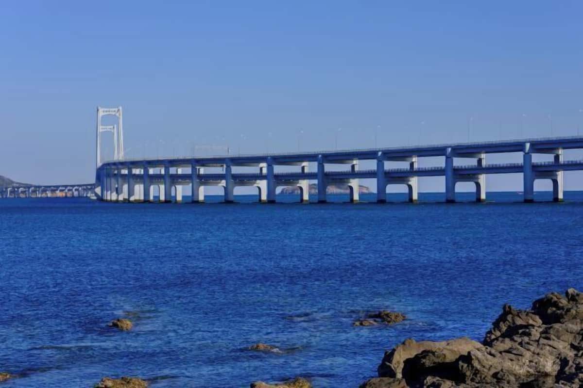 A bridge over water with rocky foreground.