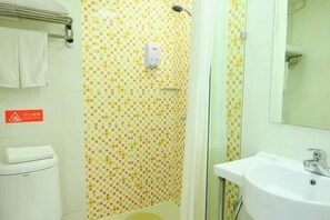 A bathroom with a tiled shower wall, a white sink, and a toilet. - Home Inn Piper Cloud (Xuzhou Dibei Xianghe Branch) (Xuzhou)