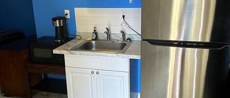Fridge, microwave, coffee/tea maker, dining tables