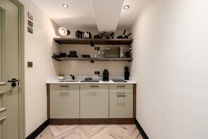 Fridge, microwave, coffee/tea maker, toaster