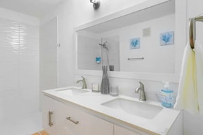 Shower, hair dryer, towels, shampoo