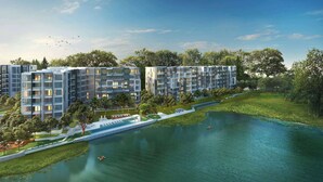 A modern apartment complex with multiple buildings, a central water feature, and surrounding greenery. - Cassia Residences, Two-Bedroom 1707 C Premium Lake (Choeng Thale)