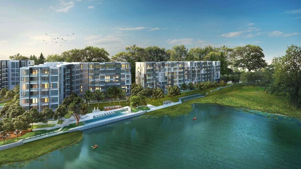 Een modern appartementencomplex met meerdere gebouwen, een centrale waterpartij en omliggend groen.