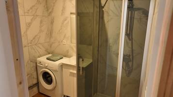 Shower, towels, soap, toilet paper