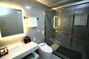 Enjoy a refreshing shower in this bathroom featuring a glass-enclosed shower, sink, and mirror.
