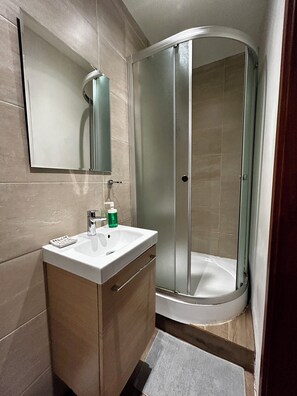 Superior Triple Room, City View | Bathroom | Shower, hair dryer, towels, soap