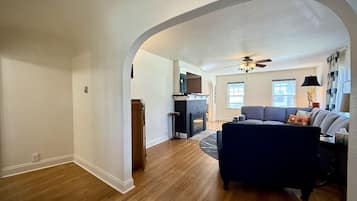 Smart TV, fireplace, books, computer monitors