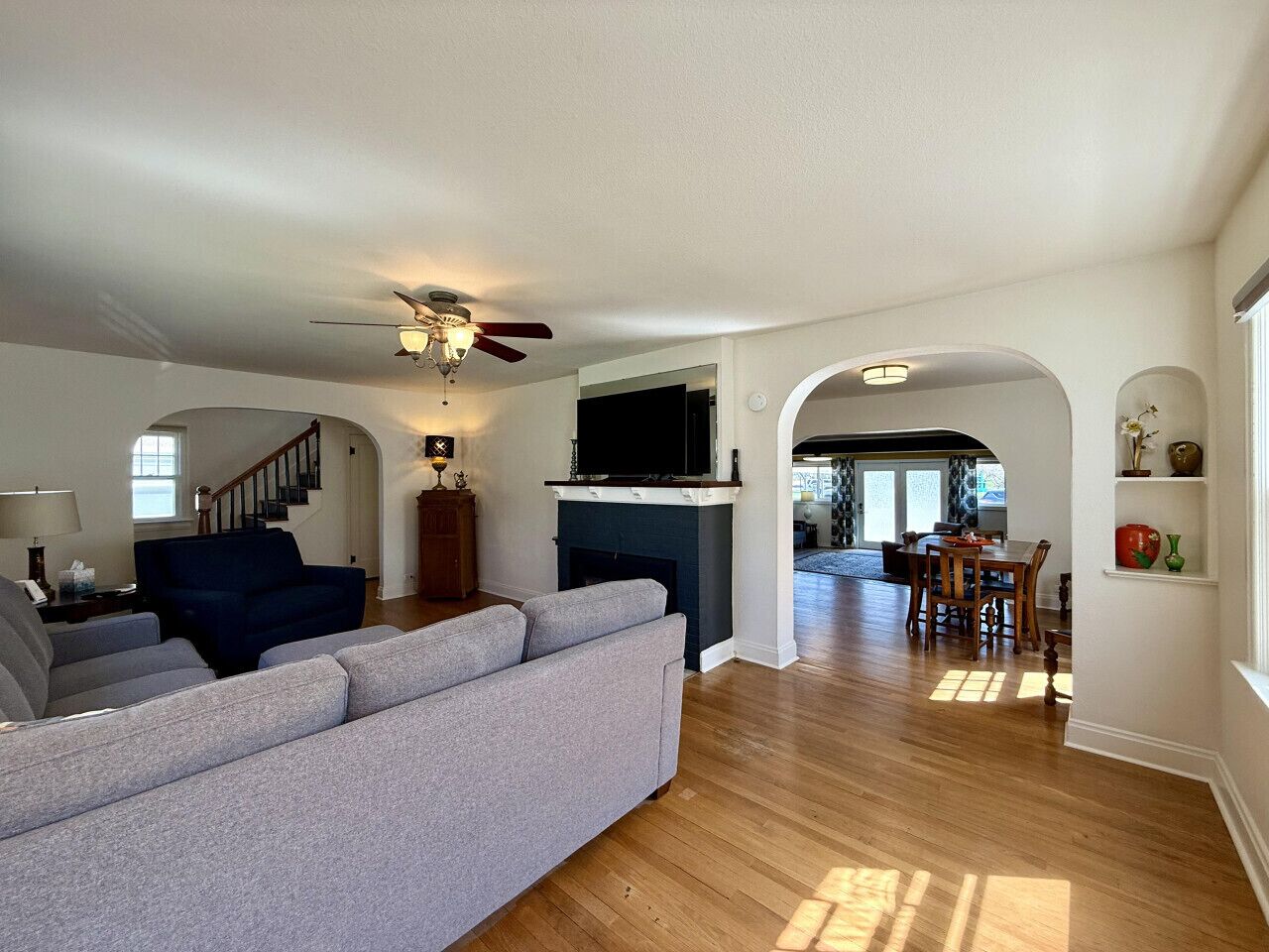 Smart TV, fireplace, books, computer monitors