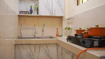 Fridge, microwave, electric kettle, cookware/dishes/utensils