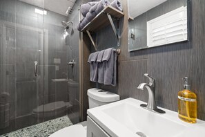 Shower, hair dryer, towels, soap