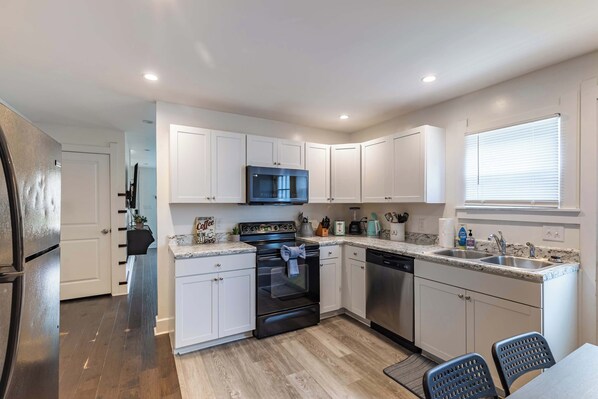 Fridge, stovetop, toaster, cookware/dishes/utensils