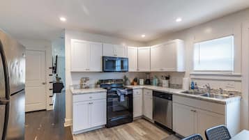 Fridge, stovetop, toaster, cookware/dishes/utensils