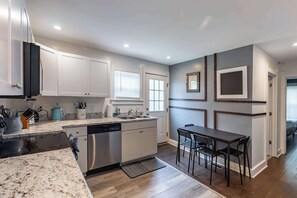 Fridge, stovetop, toaster, cookware/dishes/utensils