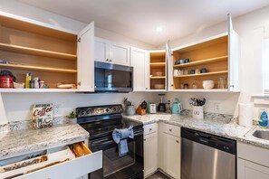 Fridge, stovetop, toaster, cookware/dishes/utensils