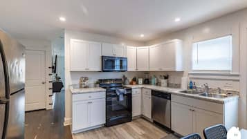 Fridge, stovetop, toaster, cookware/dishes/utensils