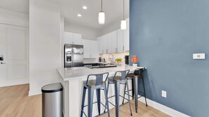 Coffee/tea maker, fridge, microwave, oven