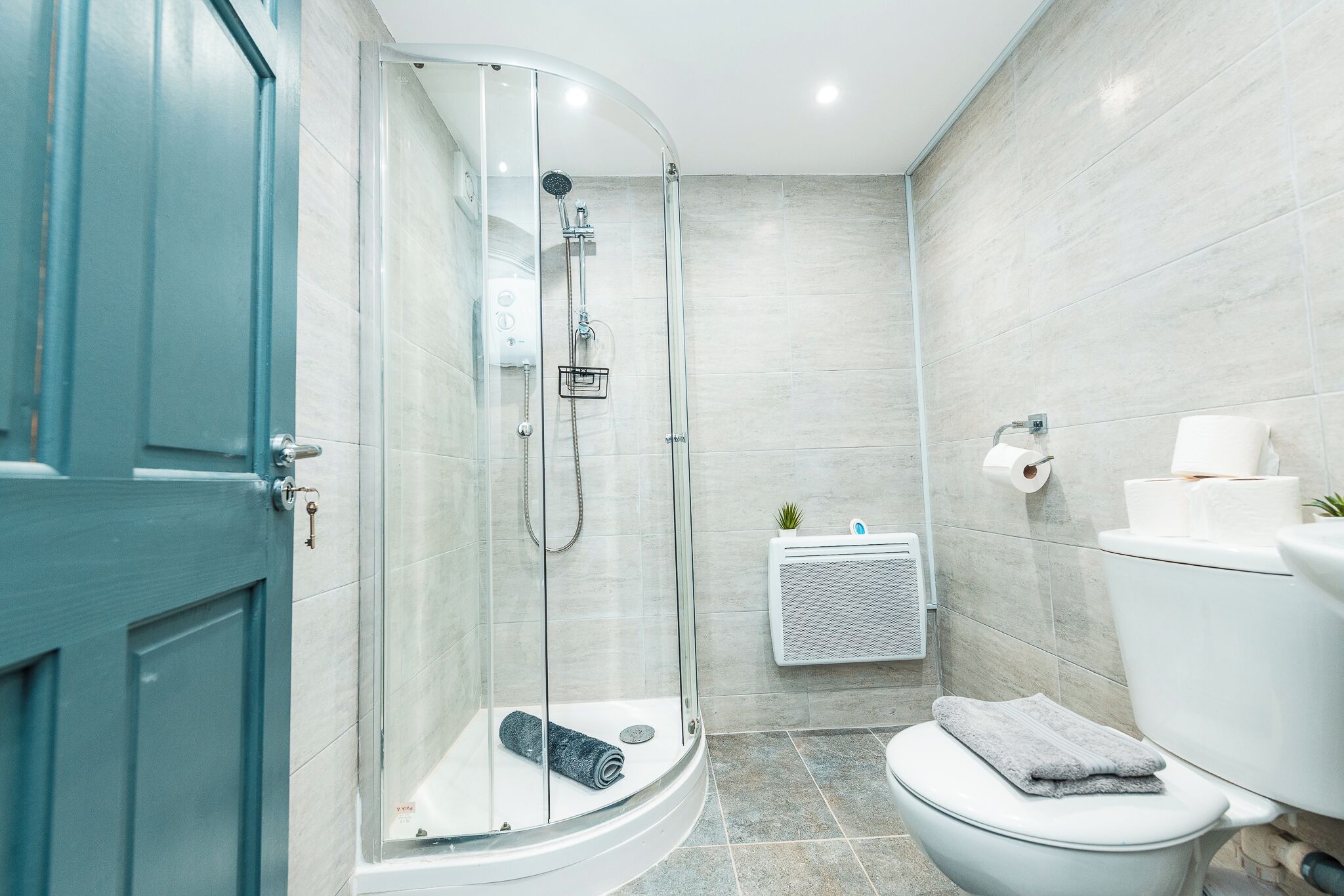 Shower, towels, soap, toilet paper