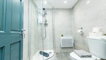 Shower, towels, soap, toilet paper