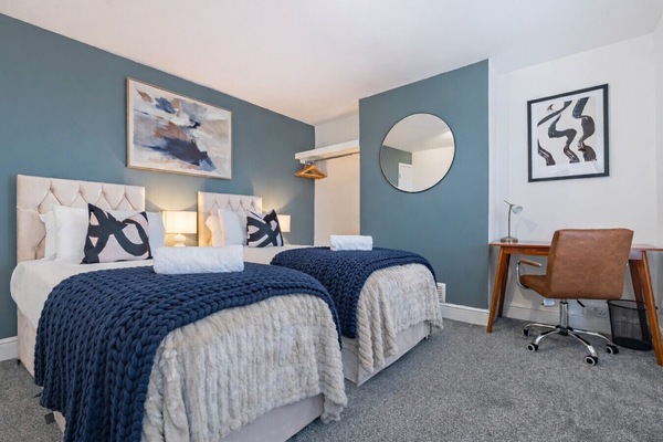 Bedroom 1 features a zip-link bed, set up as two single beds by default, which can be zipped together upon request.