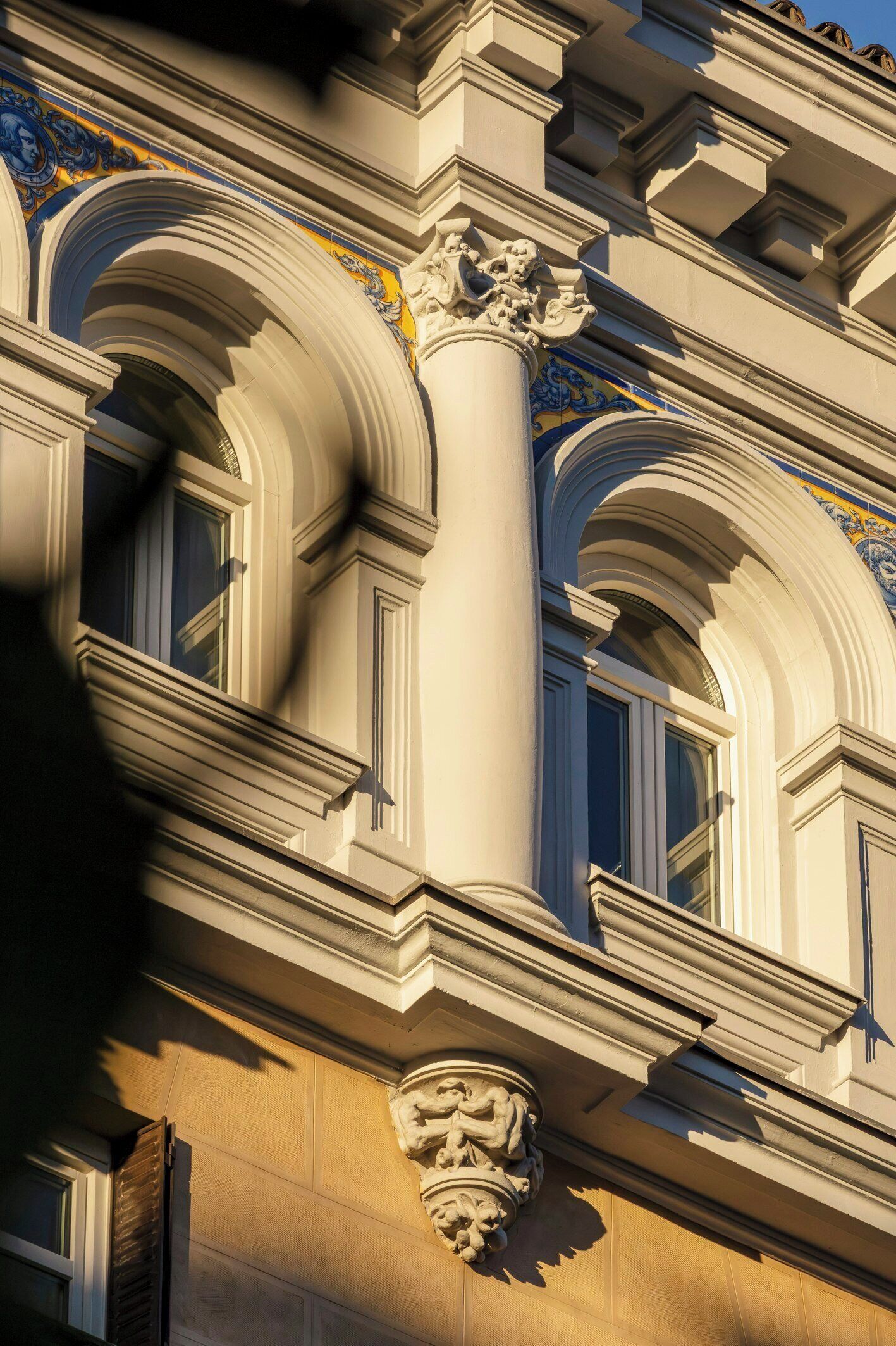 A building facade with classical architectural elements, including ornate columns and detailed moldings.